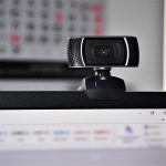 web camera attached to the top of a computer screen.