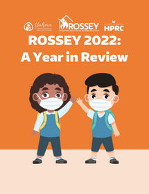 Two school children in masks wave